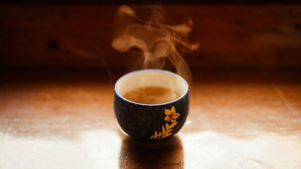 Green tea leaves and cup